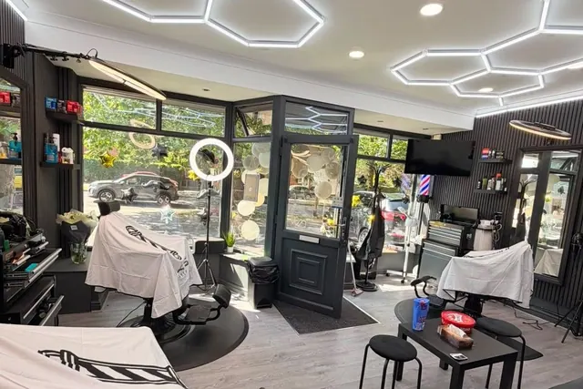 The chairs and window at M.A.S Barbers